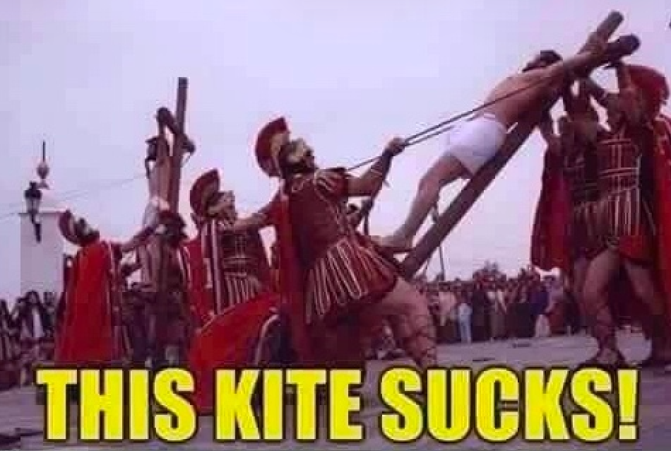 Scene from a historical reenactment of Roman soldiers carrying a cross, captioned This Kite Sucks