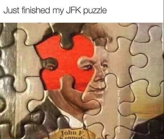 Chaotic Meh meme titled “Just Finished My JFK Puzzle.”